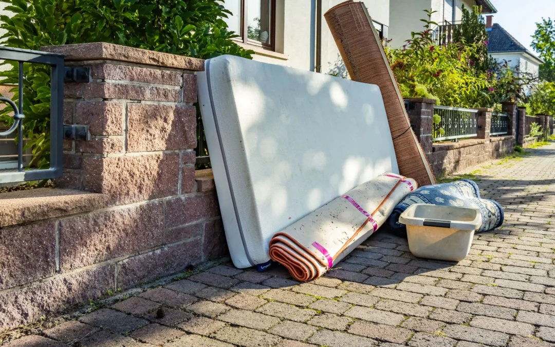 junk removal team loading bulky household items for disposal in Edmonton