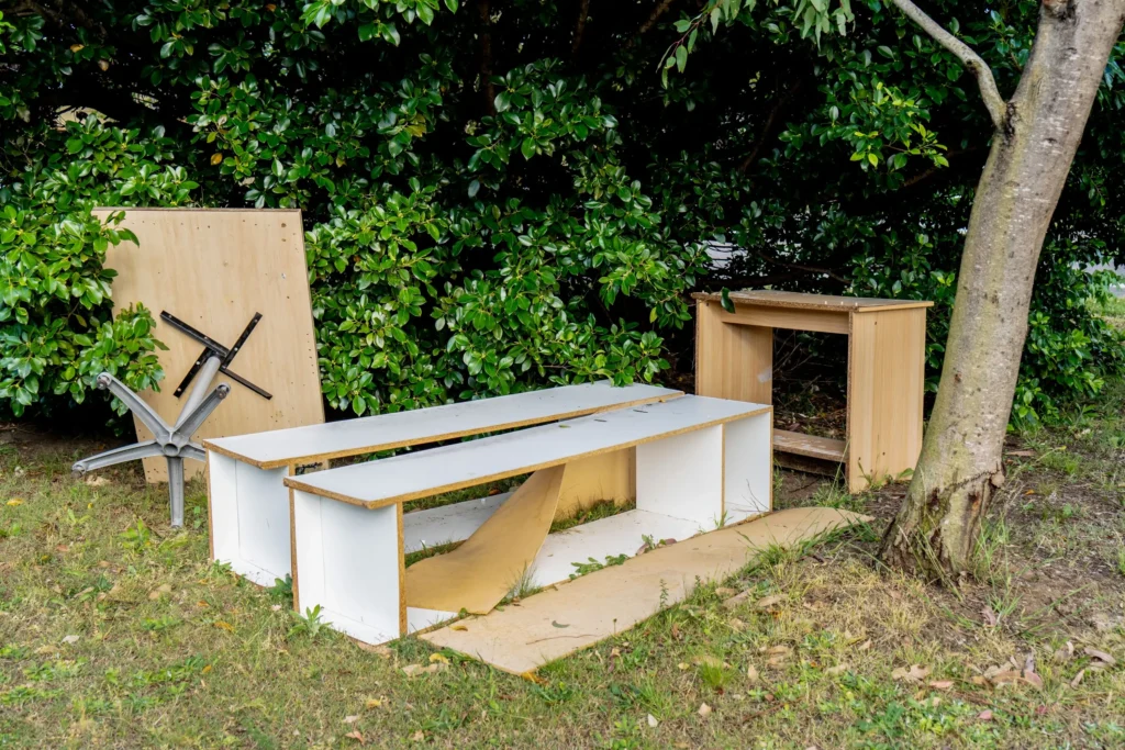 Current image: team removing old patio furniture and wood debris from Edmonton backyard