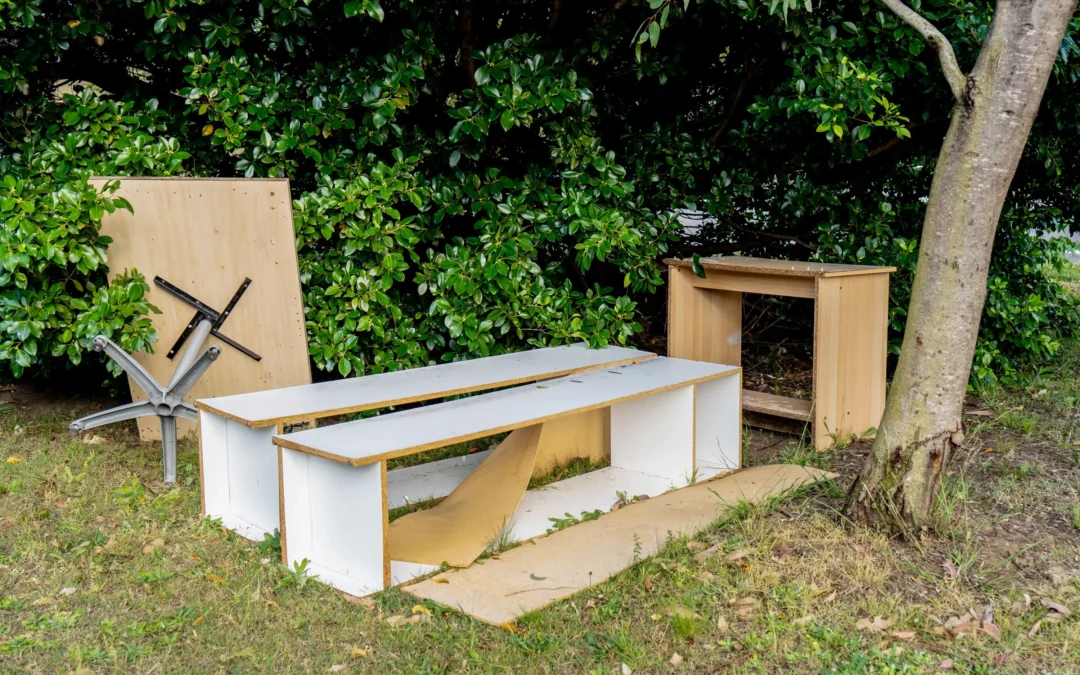 team removing old patio furniture and wood debris from Edmonton backyard